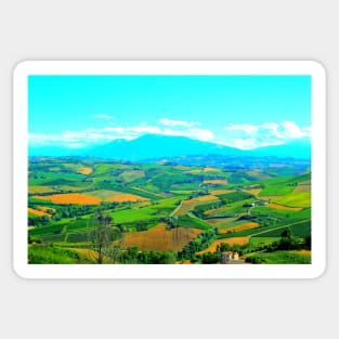 Scene in Carassai with fields sectoring the lands and impressive mountains Sticker